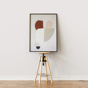 Framed minimalist abstract art with organic shapes in earthy tones, displayed in a black frame, ideal for contemporary and modern spaces.