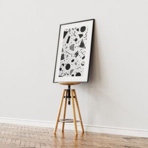 Modern black and white geometric artwork in a sleek black frame,