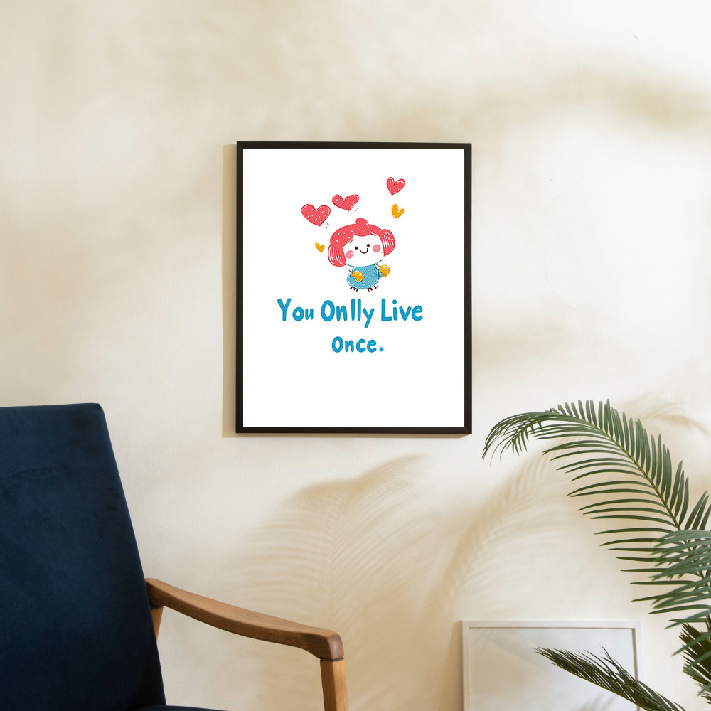 Framed poster with the playful phrase 'You Only Live Once' accompanied by a cute character and hearts, placed on a modern white console in a bright room.