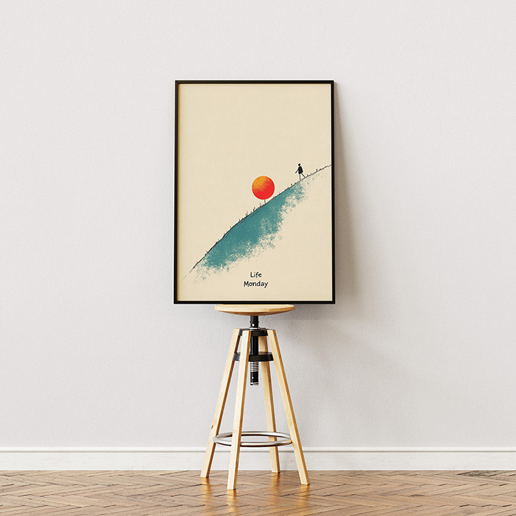 Framed minimalist poster featuring a silhouette of a person climbing a slope with a red sun above, and the words "Life Monday" below, displayed on a stool against a light-colored wall.