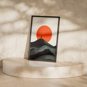 Framed minimalist poster depicting a solitary figure on a peak with rolling hills and a large red sun in the background, displayed on a curved stone platform against a textured wall.