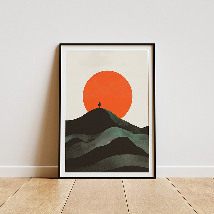 Framed minimalist poster depicting a solitary figure on a peak with rolling hills and a large red sun in the background, displayed on a curved stone platform against a textured wall.